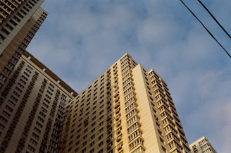 a very tall building with a sky background
