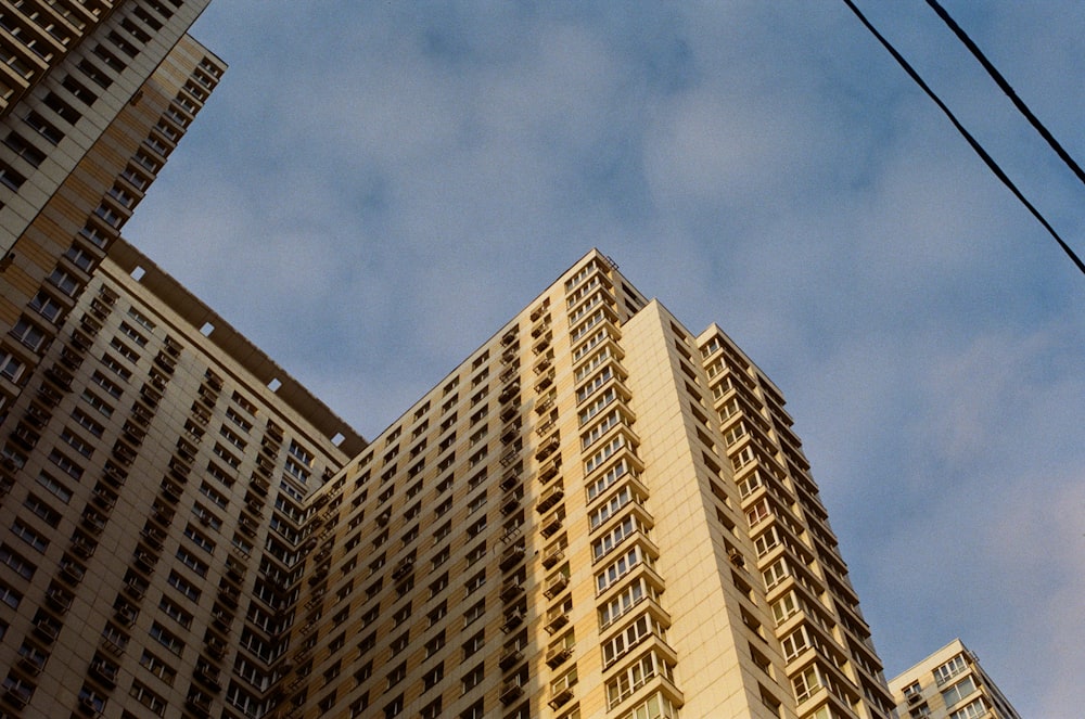 a very tall building with a sky background