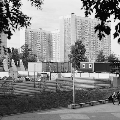 a black and white photo of a city with tall buildings