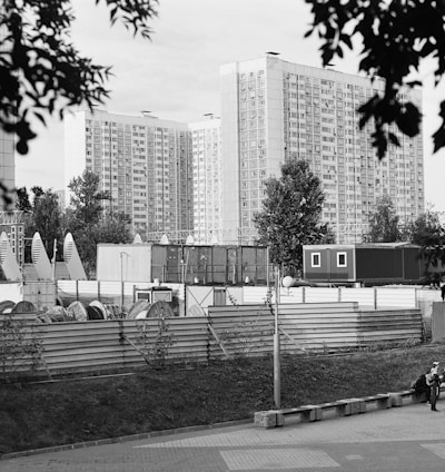 a black and white photo of a city with tall buildings