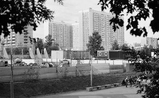 a black and white photo of a city with tall buildings