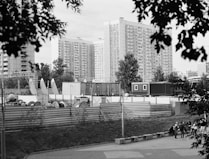 a black and white photo of a city with tall buildings