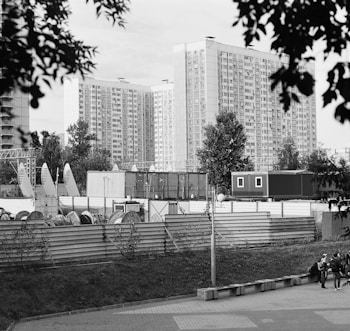 a black and white photo of a city with tall buildings