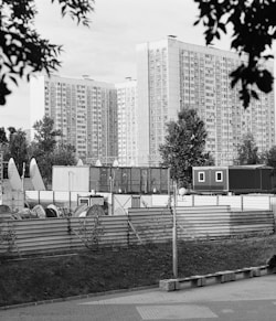 a black and white photo of a city with tall buildings