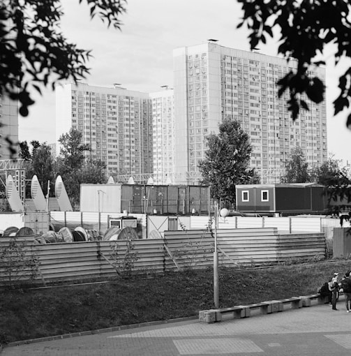 a black and white photo of a city with tall buildings