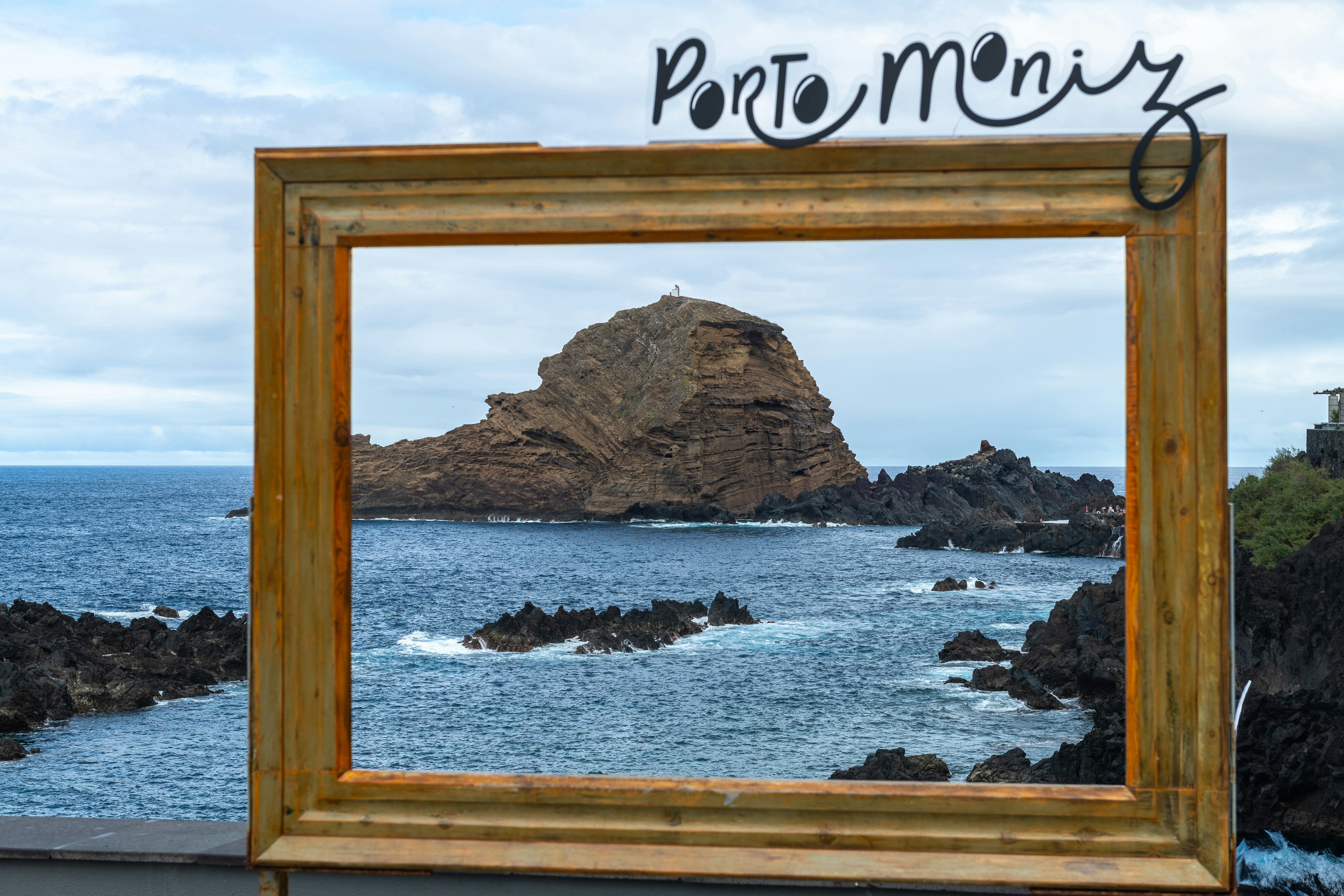 a picture frame sitting on top of a wooden table