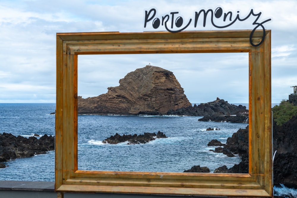 a picture frame sitting on top of a wooden table