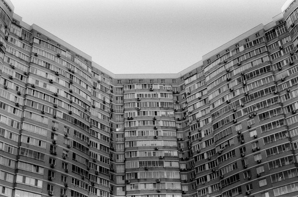 a black and white photo of a very tall building