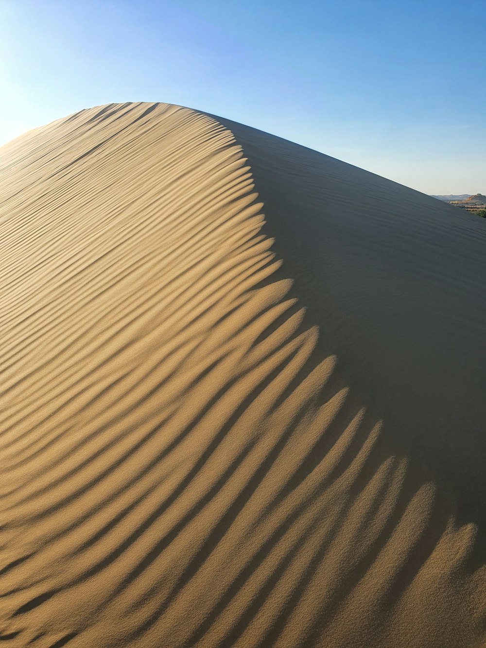 a large sand dune in the middle of a desert