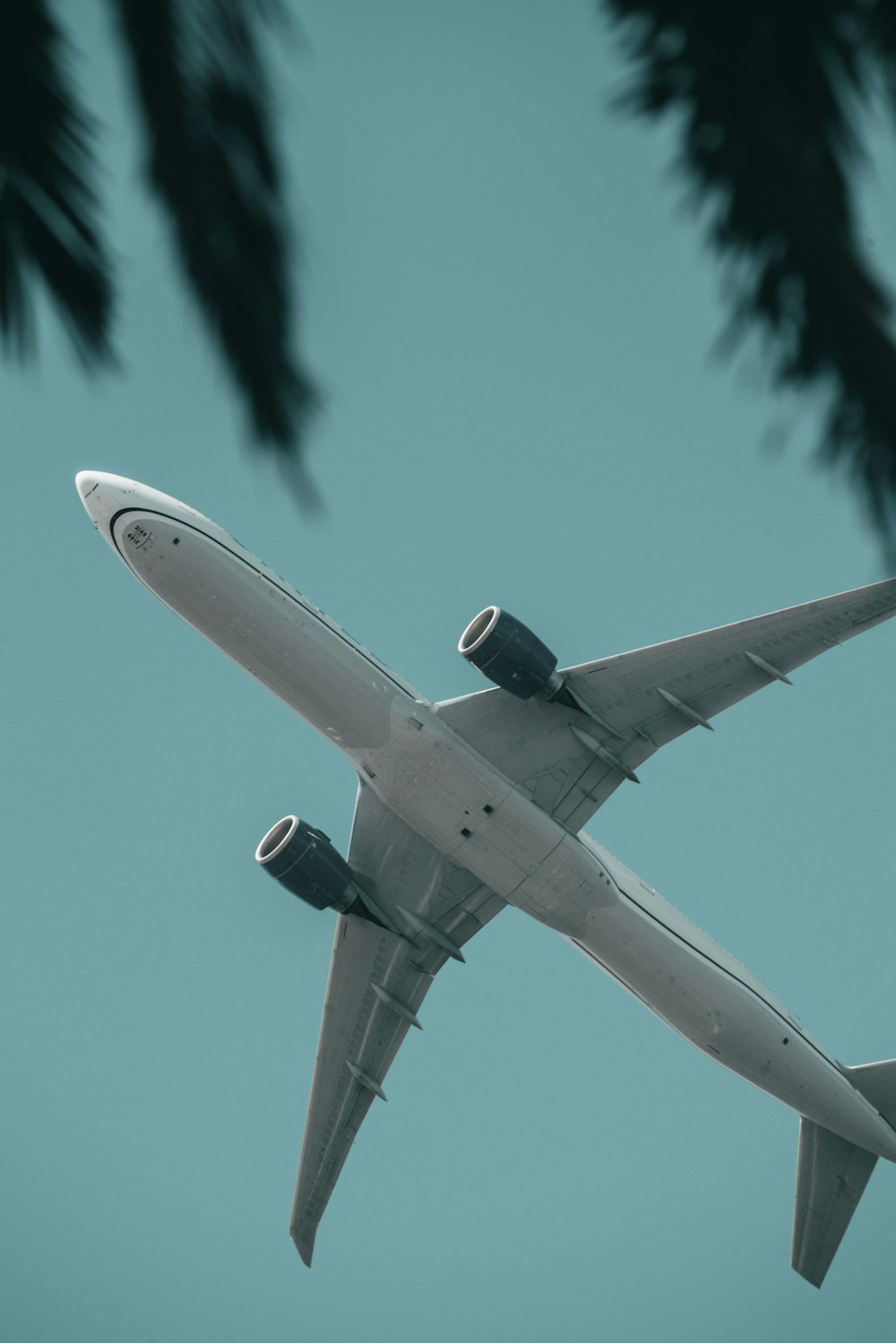 a large jetliner flying through a blue sky