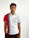 A person is wearing a sporty polo shirt featuring vertical red and blue stripes on a white background. The shirt has a design or logo with the number '1969' on the upper left side. The person's expression is calm and they are looking directly at the camera.