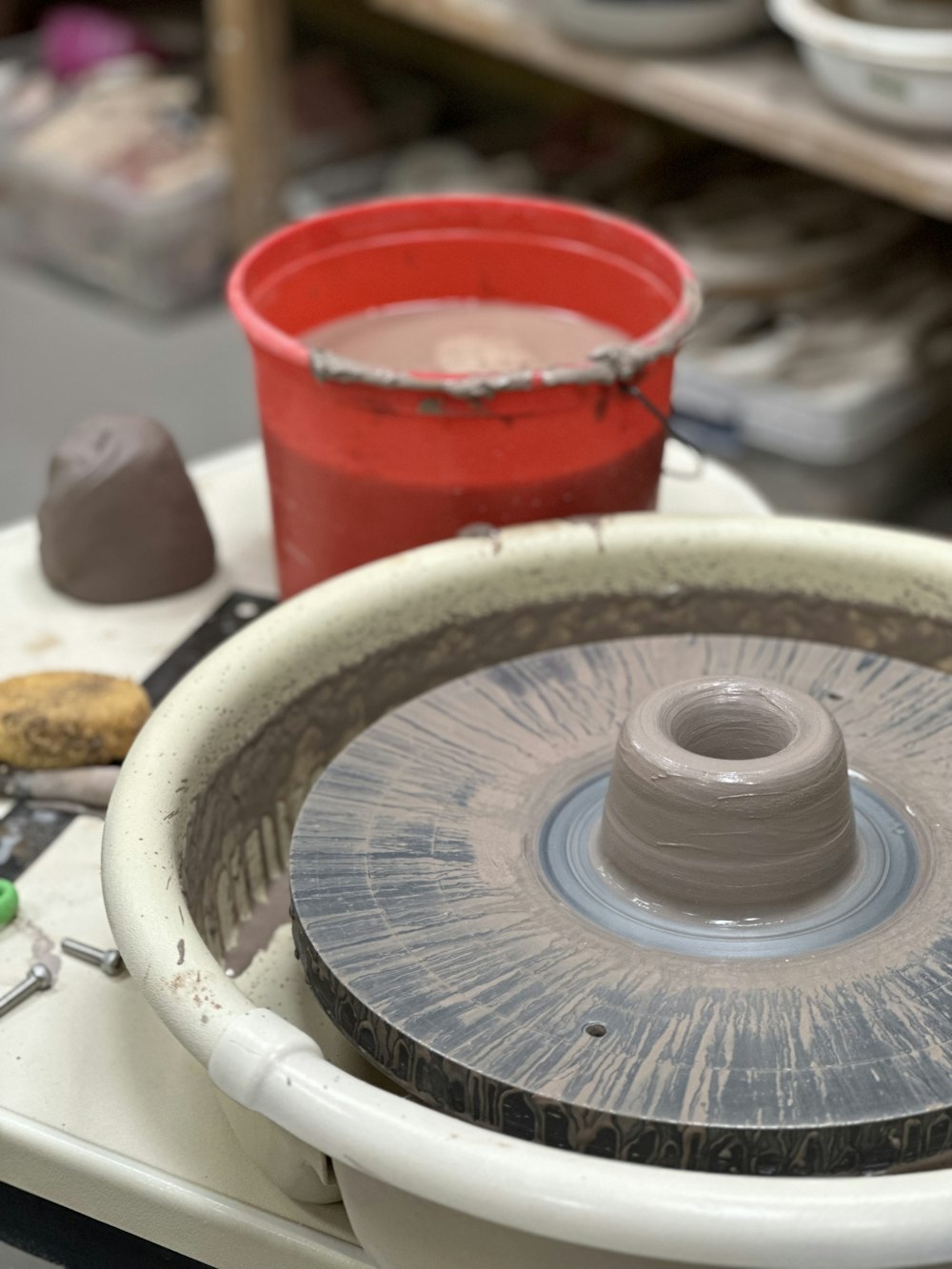 a pottery wheel sitting on top of a table