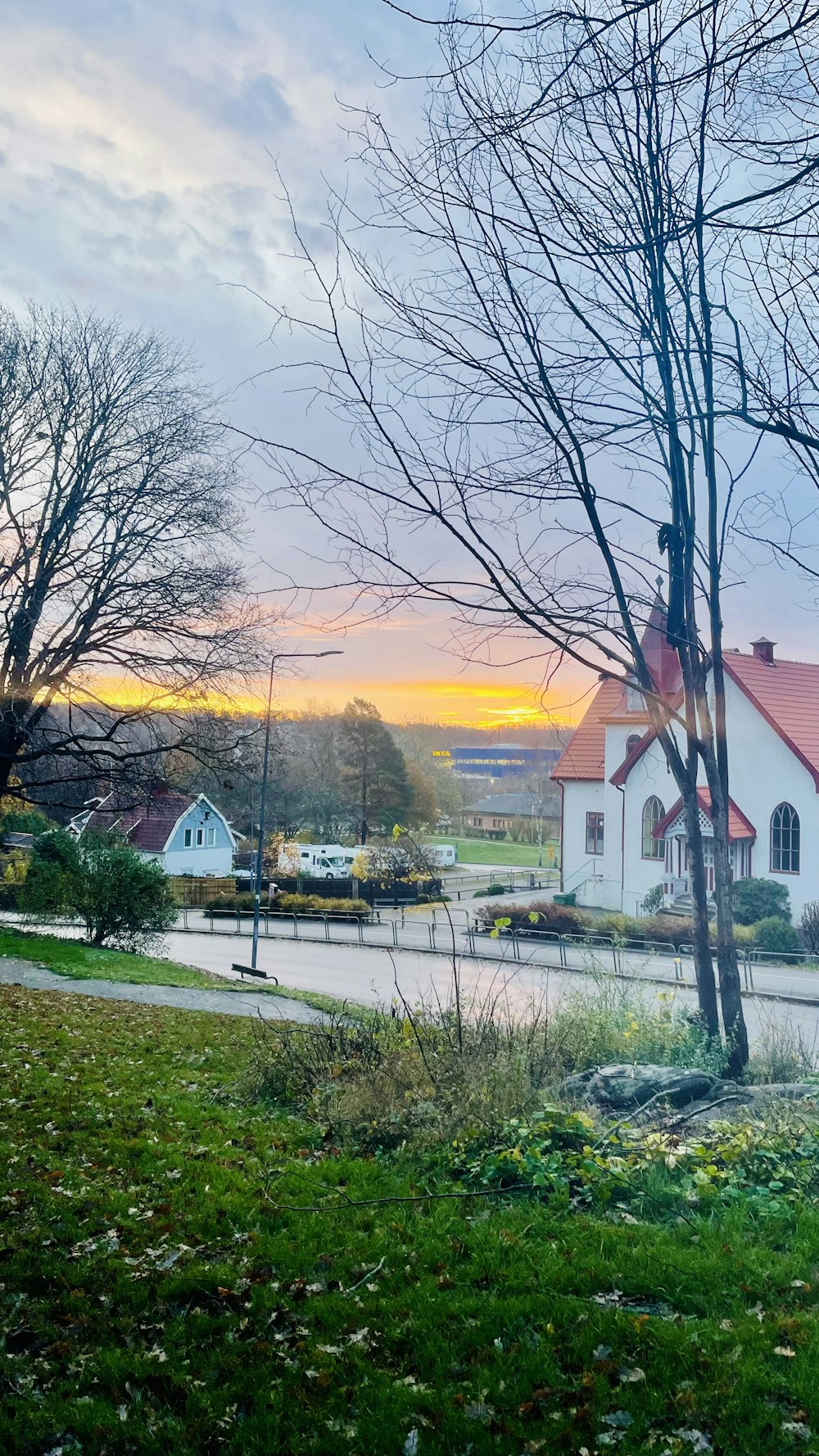 a small white church with a red roof