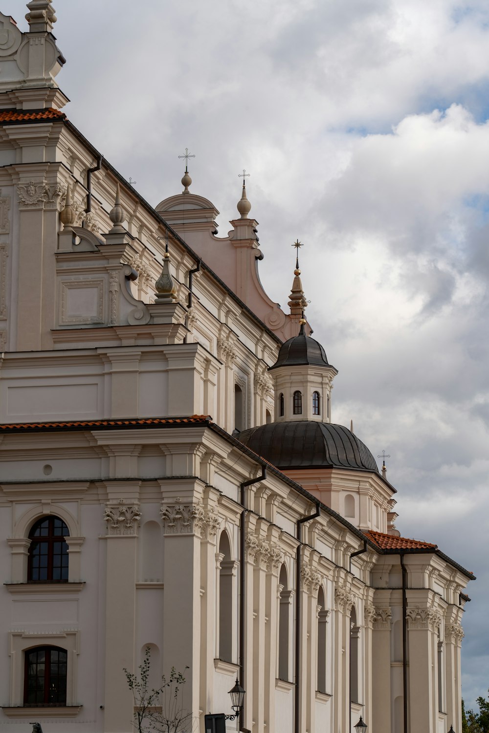 a large white building with a clock tower