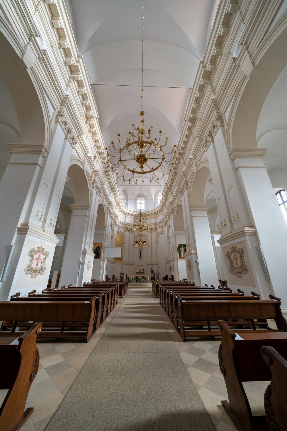 a church with a chandelier hanging from the ceiling