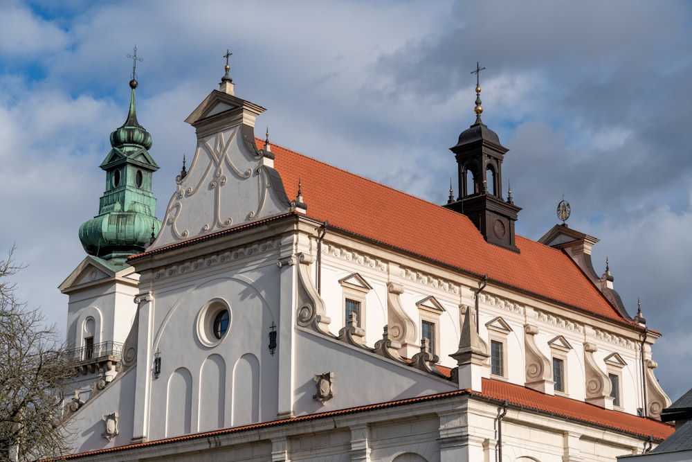 a large white building with a red roof