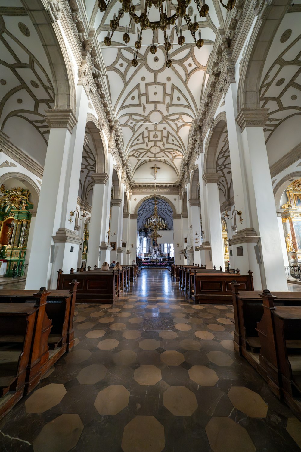 a church with a chandelier hanging from the ceiling