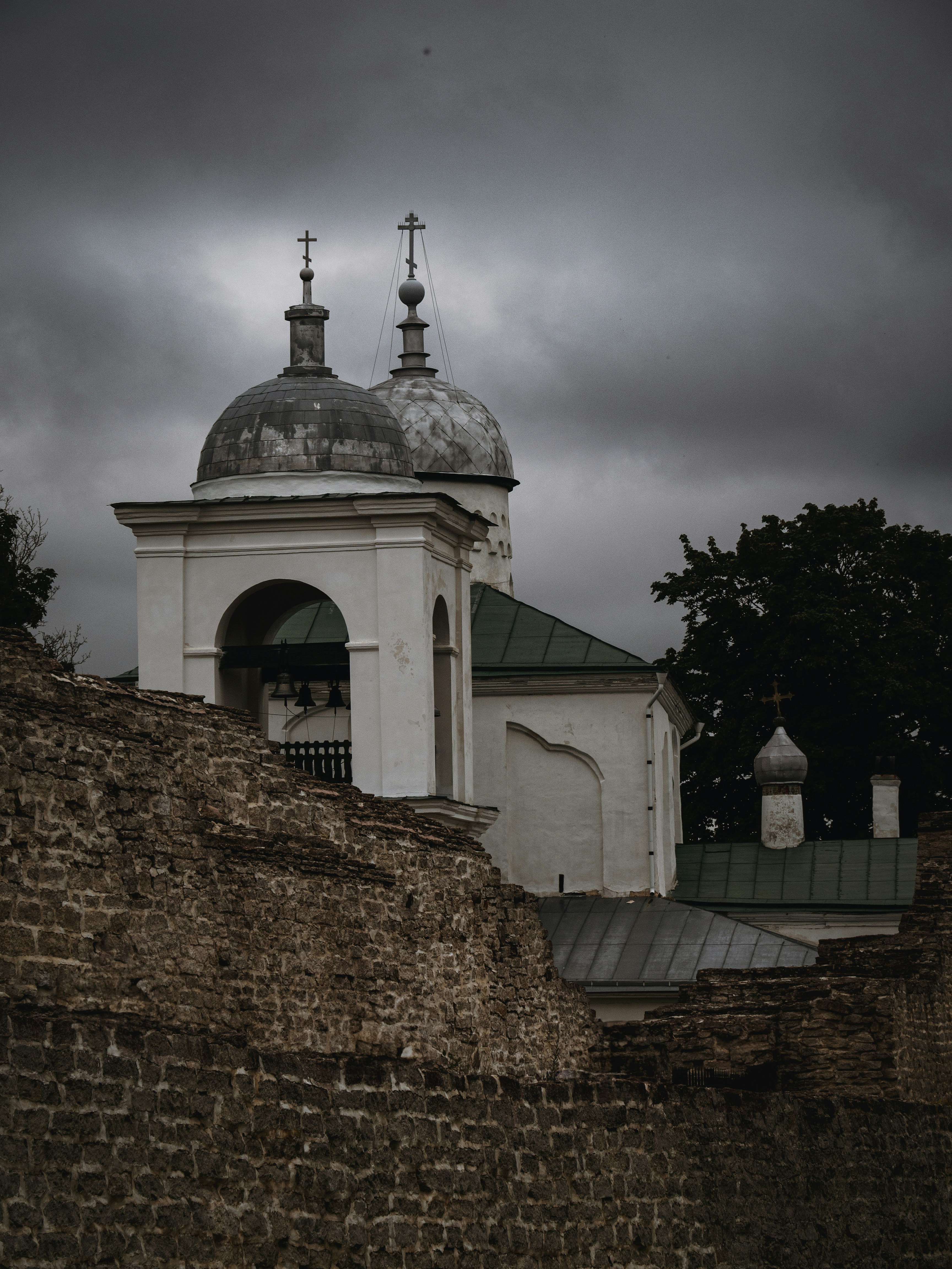 a white building with a cross on top of it