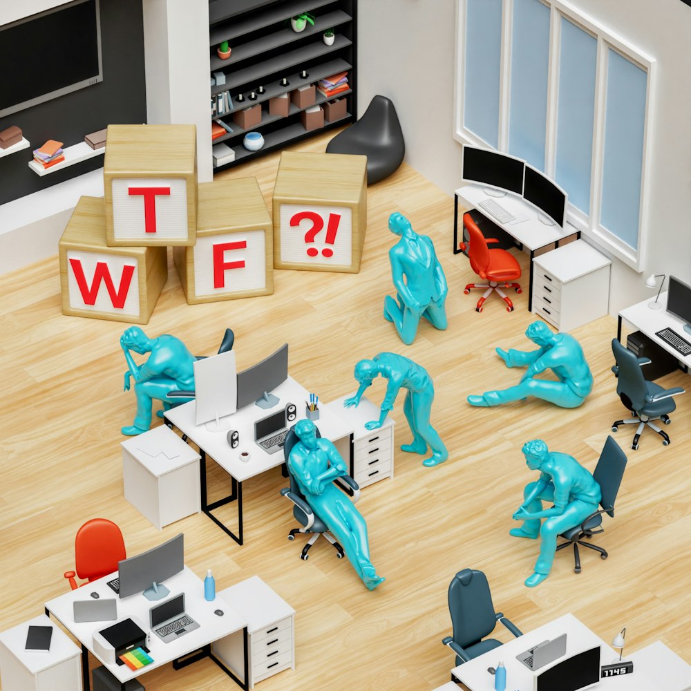 a group of blue plastic figures sitting in an office