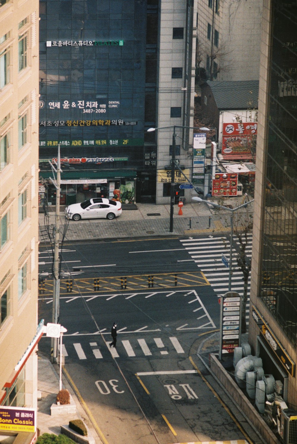 a view of a city street from a tall building