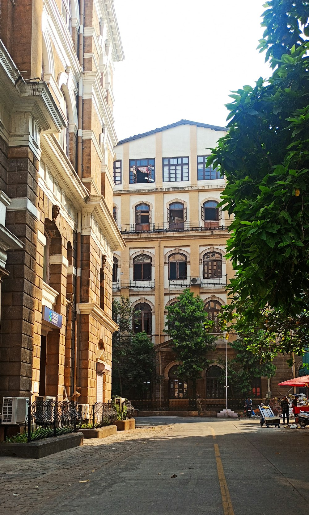 an empty street with a building in the background