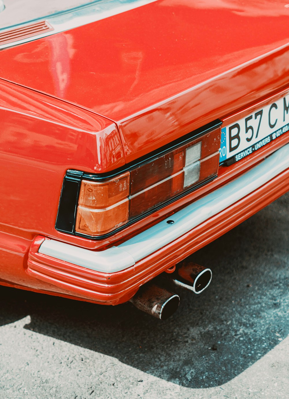 a red car parked in a parking lot