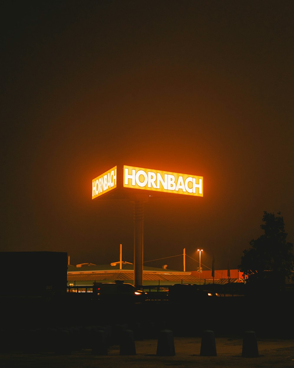 a large hornback gas station sign lit up at night
