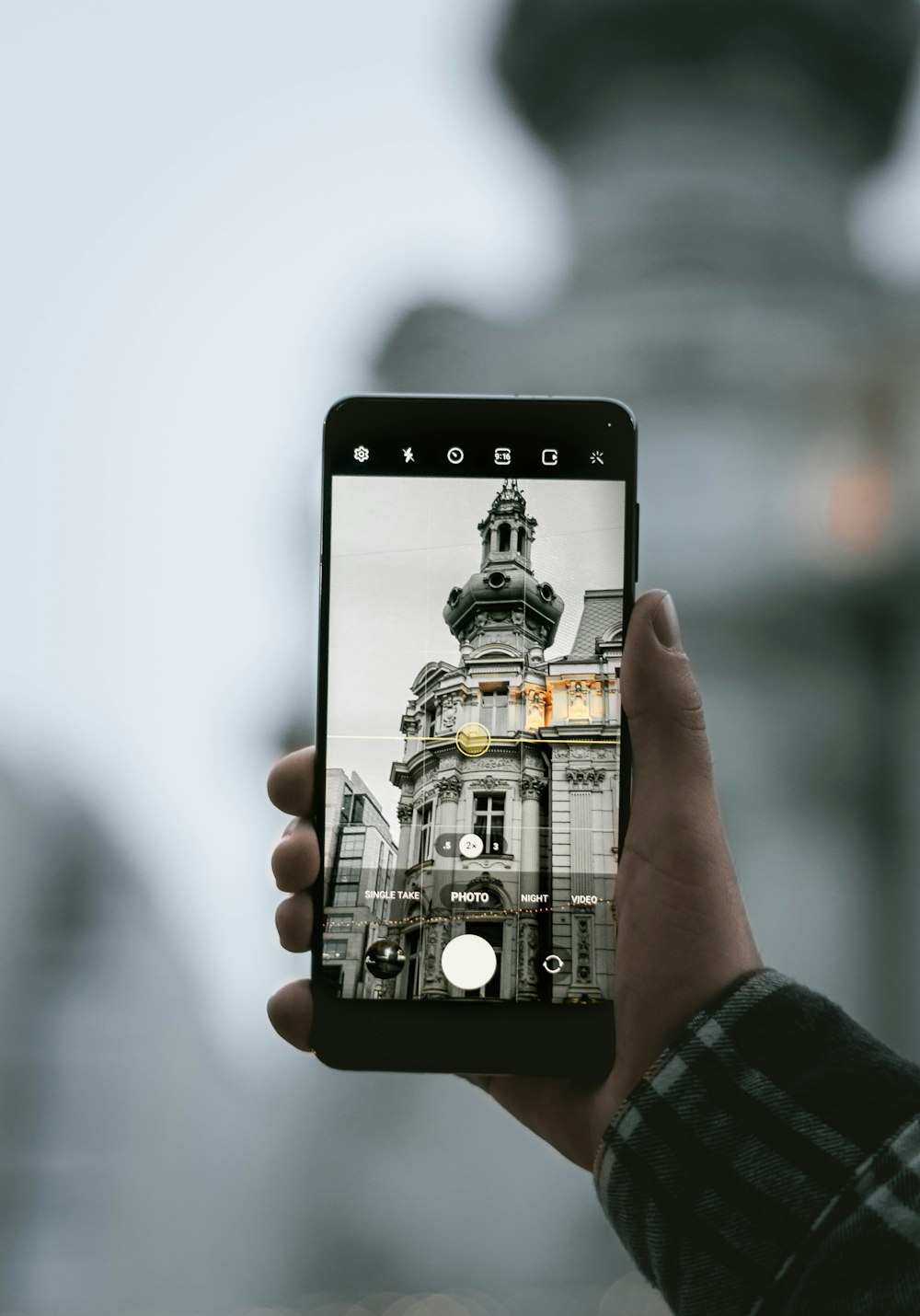 a person taking a picture of a building