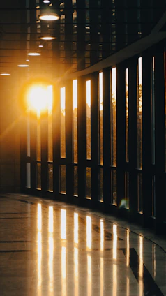 A serene and elegant entrance of a modern boutique home bathed in warm sunset light.