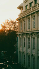 Sophisticated architectural detail of a luxury real estate development at sunset.