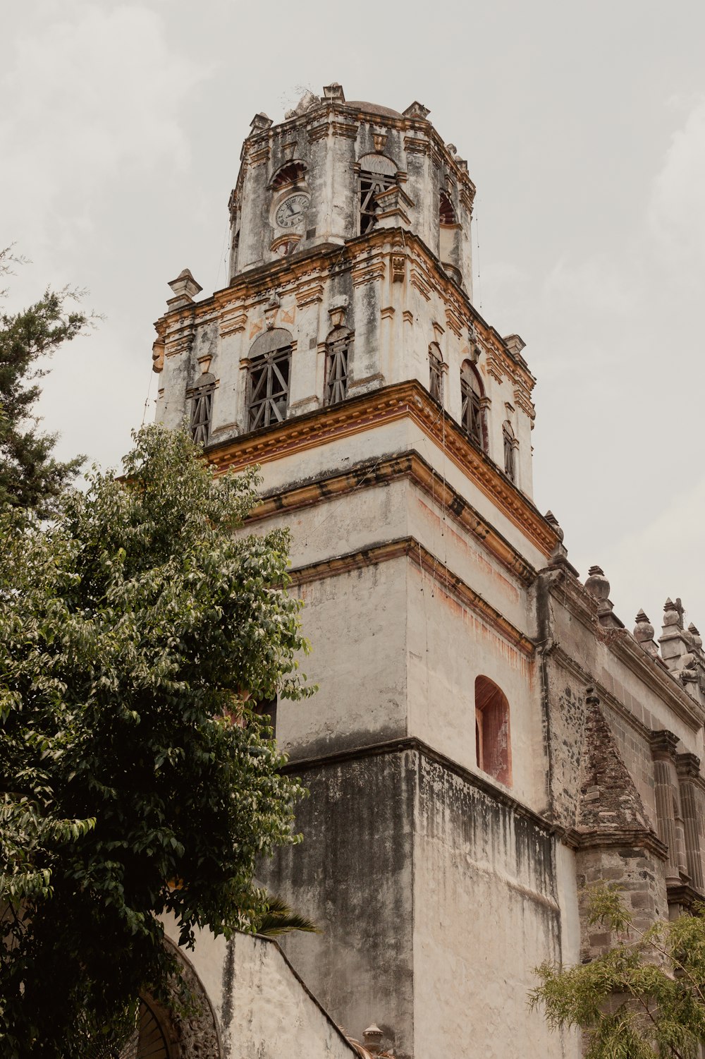 a tall tower with a clock on the top of it