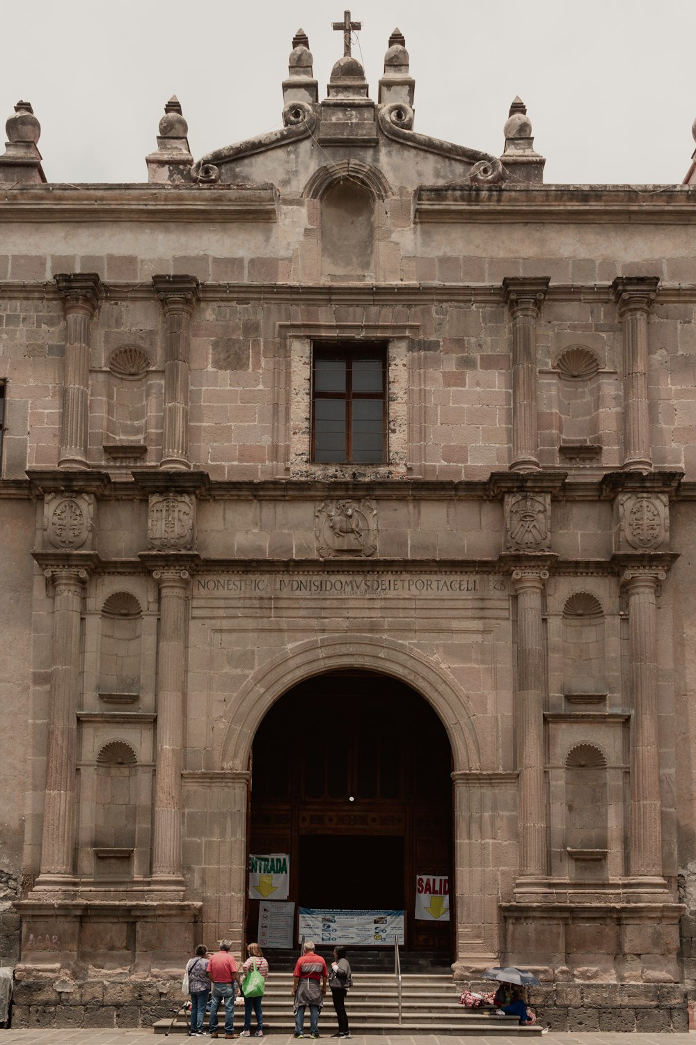 a group of people standing in front of a building