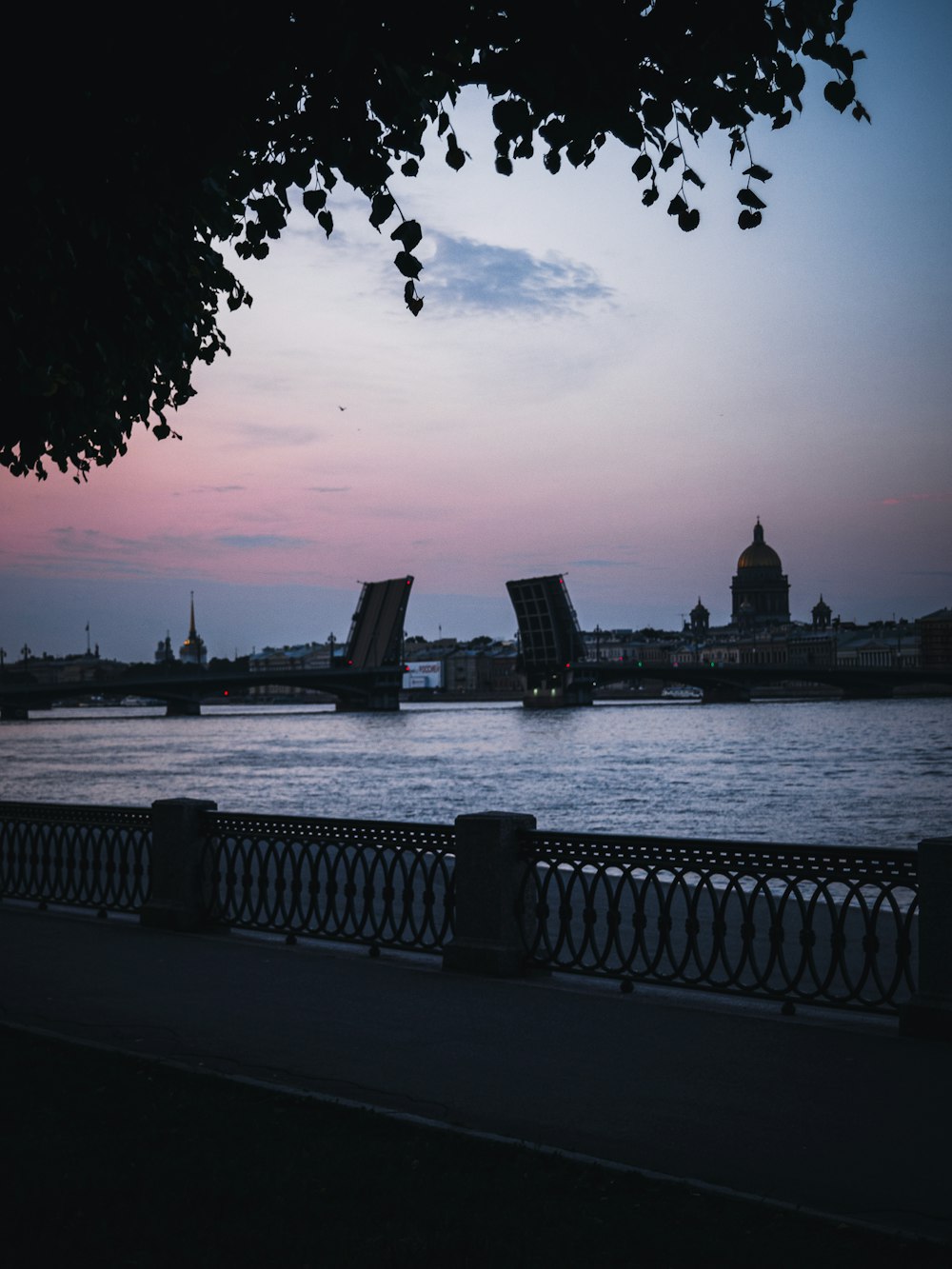 a view of a body of water with a bridge in the background