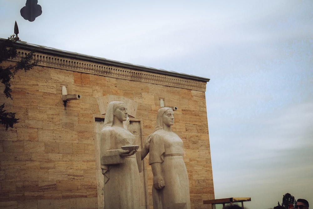 a couple of statues standing next to each other