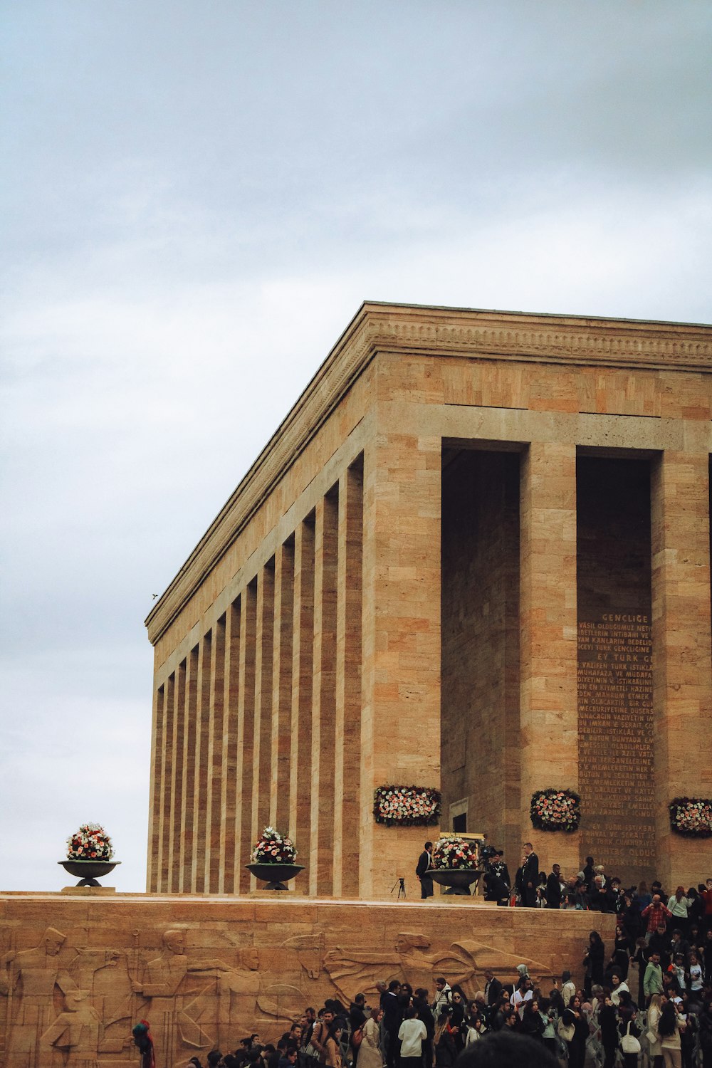 a crowd of people standing in front of a building