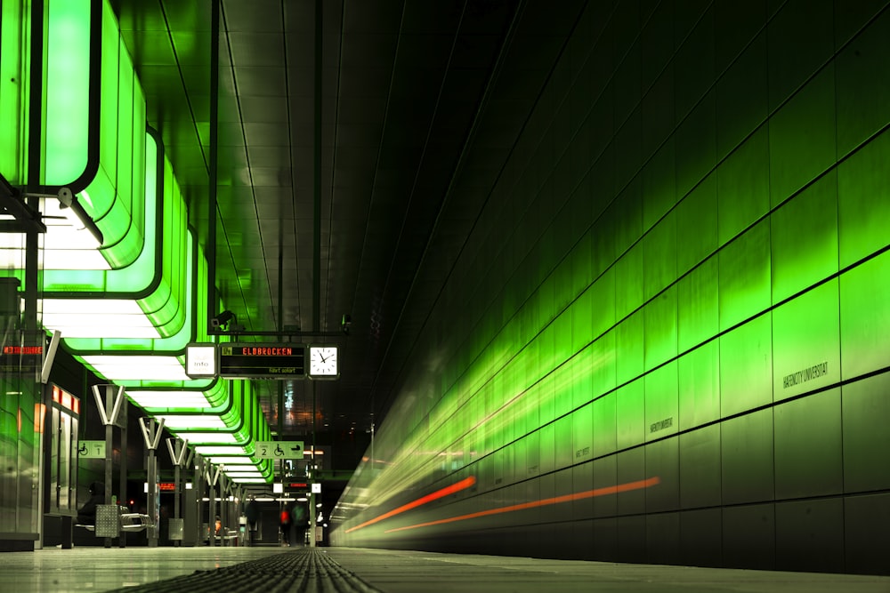 a long exposure photo of a subway station