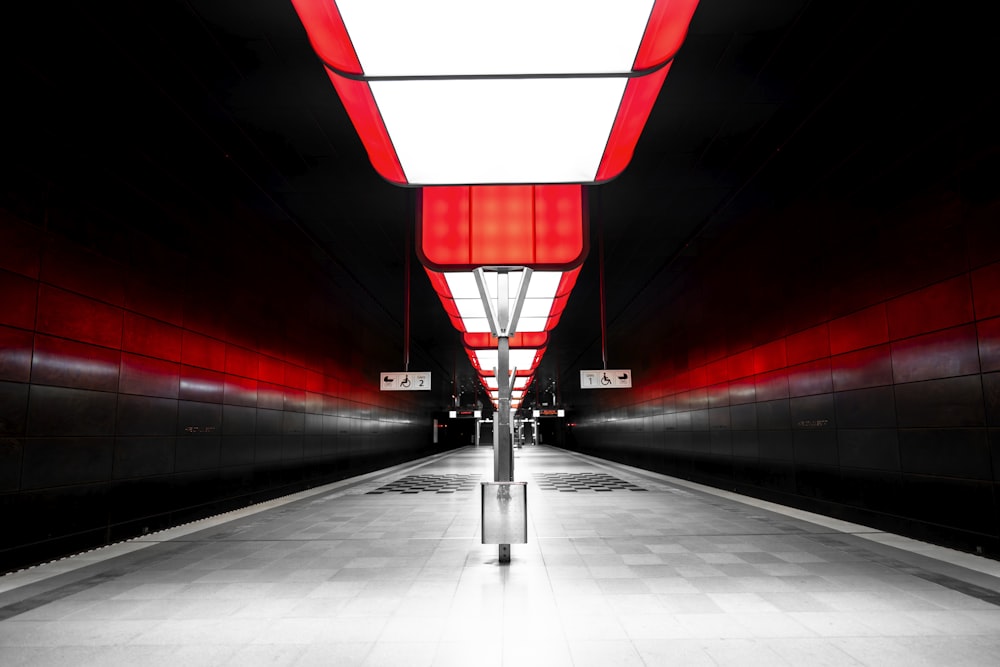 a long hallway with red and white walls