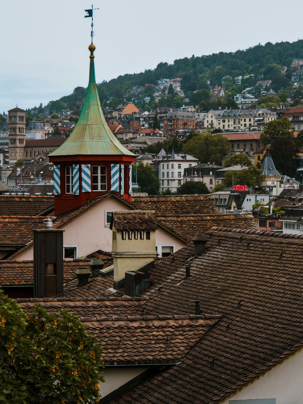 a clock tower on top of a building in a city