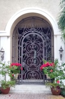 An elegant iron gate at the entrance of a home.