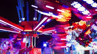 An immersive VR carnival ride scene showing bright, swirling lights and excited players.