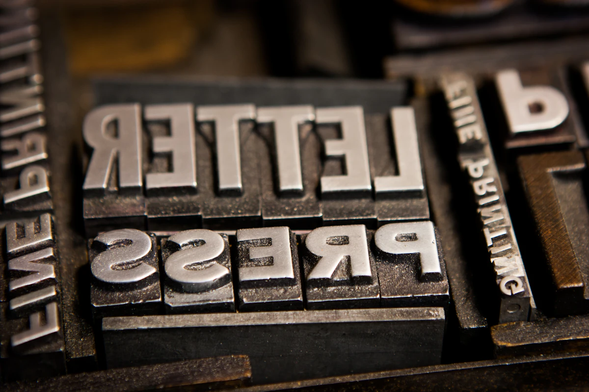 Metal letterpress type blocks spelling LETTERPRESS, arranged for proofing