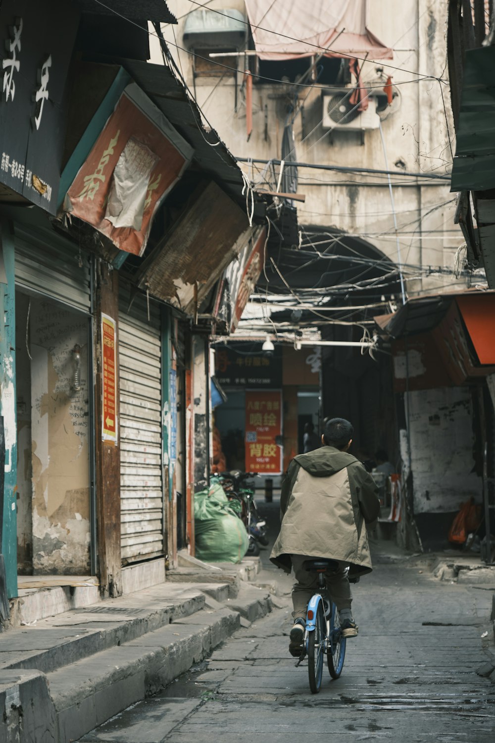 a person riding a bike down a street