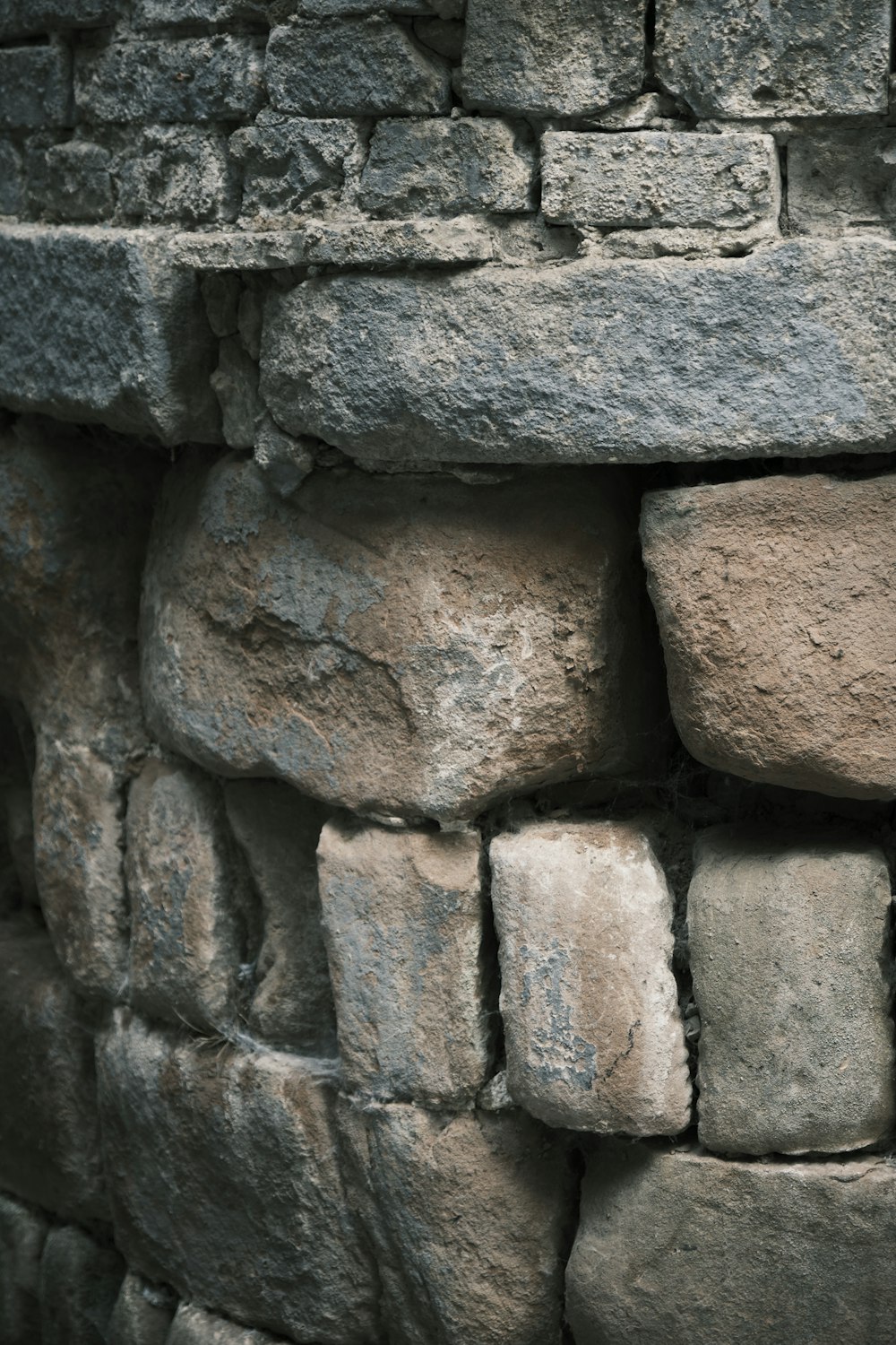 a close up of a stone wall made of rocks