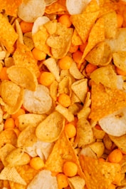 a close up of a pile of corn chips