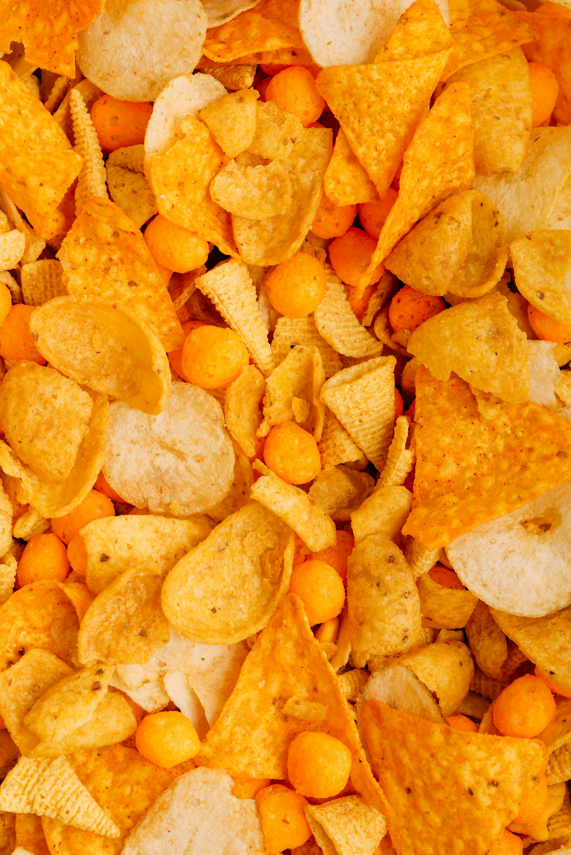 a close up of a pile of corn chips