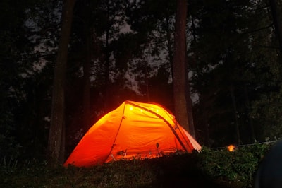 Close-up of a welcoming campsite reception area bathed in warm orange light.