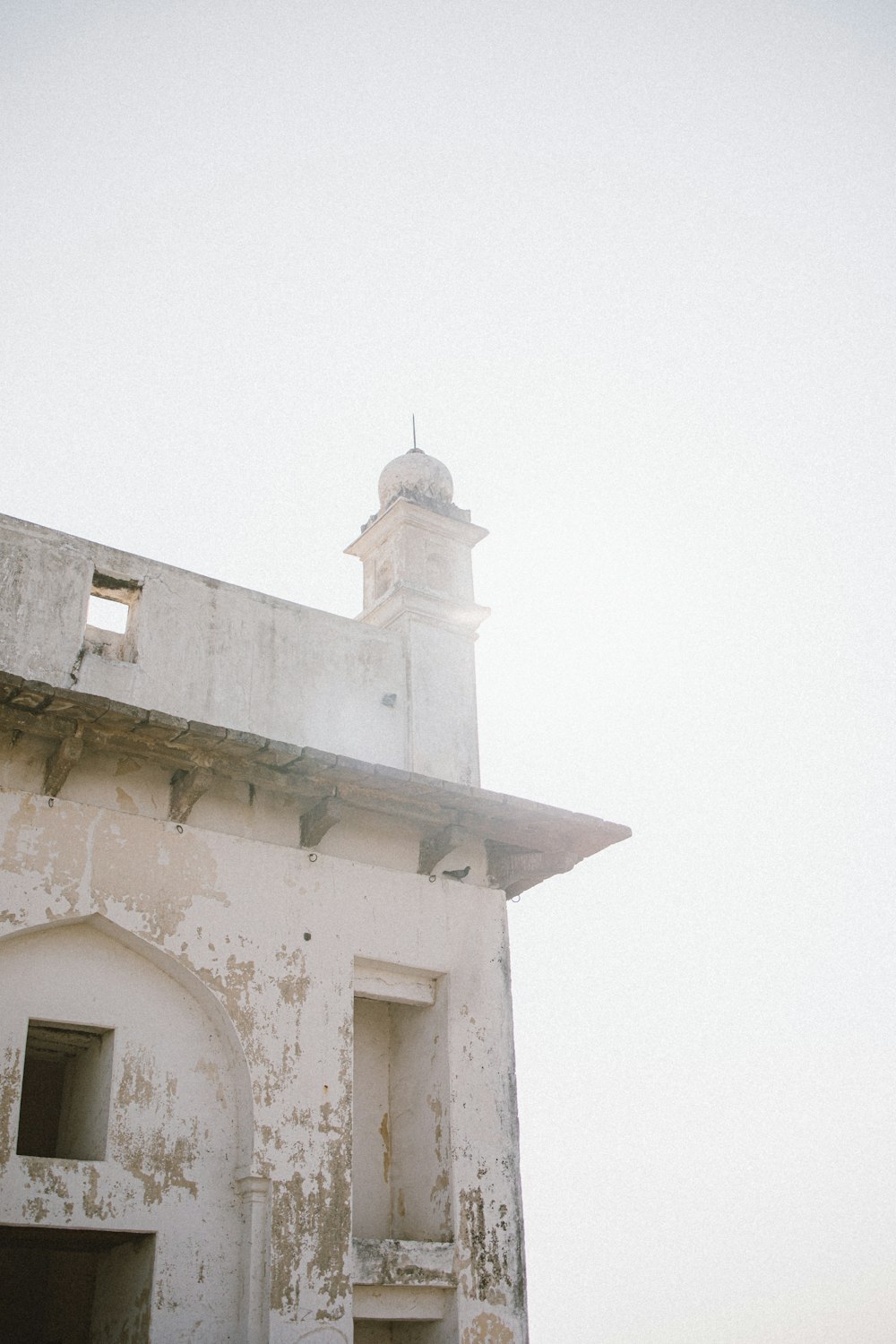 an old building with a clock tower on top of it