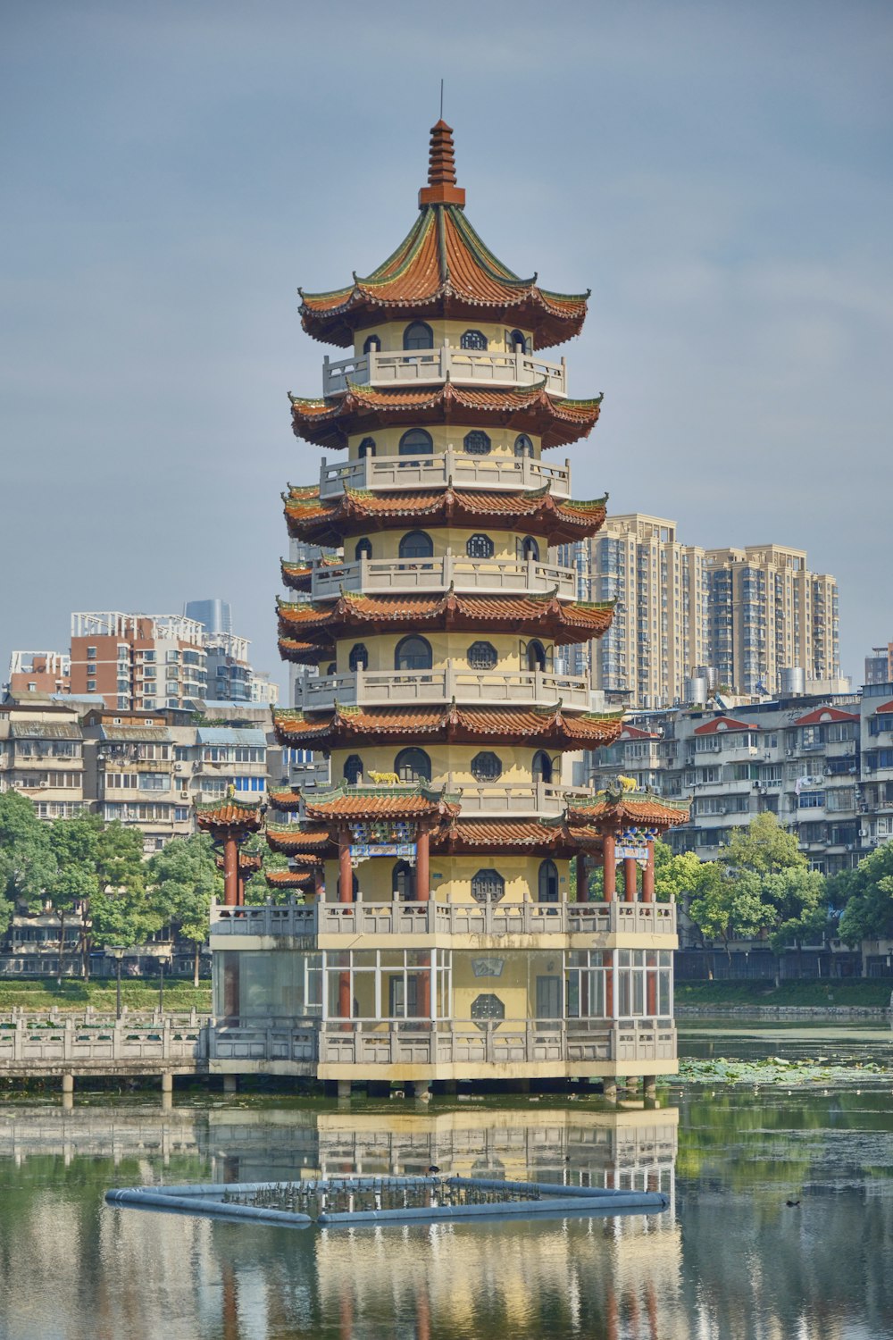 a tall tower sitting on top of a body of water