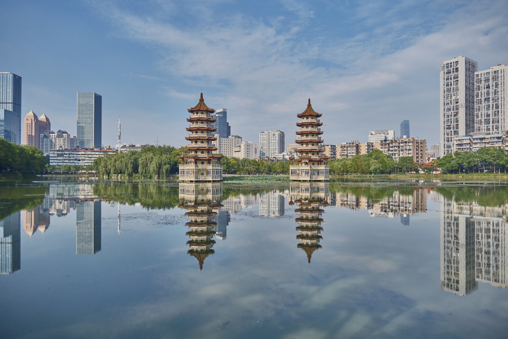 a body of water with buildings in the background