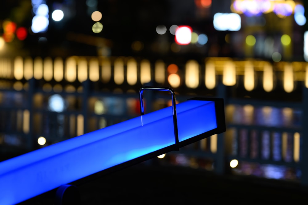 a bench that is lit up at night